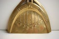 Brass brush and dustpan with art nouveau decoration.