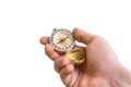 Antique brass compass in a hand isolated on white Royalty Free Stock Photo