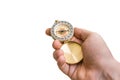 Antique brass compass in a hand isolated on white Royalty Free Stock Photo