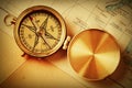 Antique brass compass over map