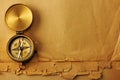 Antique brass compass over old background Royalty Free Stock Photo