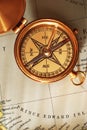 Antique brass compass over old Canadian map Royalty Free Stock Photo