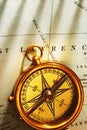 Antique brass compass over old Canadian map Royalty Free Stock Photo