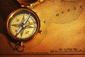 Antique brass compass over old USA map Royalty Free Stock Photo