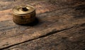 Antique Brass Container on Rustic Wooden Table Royalty Free Stock Photo