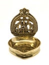 an antique brass kamatchi diya oil lamp with a hindu god carving Royalty Free Stock Photo