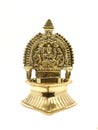 an antique brass kamatchi diya oil lamp with a hindu god carving Royalty Free Stock Photo