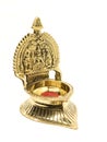 an antique brass kamatchi diya oil lamp with a hindu god carving Royalty Free Stock Photo