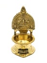 an antique brass kamatchi diya oil lamp with a hindu god carving Royalty Free Stock Photo