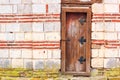 Antique brick wall with old wooden door, byzantine ancient masonry Royalty Free Stock Photo