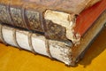 Antique broken books over a yellow background. Literature Royalty Free Stock Photo