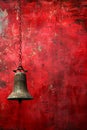 Antique Bronze Bell Hanging Against Textured Vibrant Red Wall Background, Artistic Retro Concept