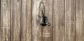 Antique bronze bell on an old wooden door Royalty Free Stock Photo