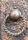 Antique bronze bell on an old wooden door Royalty Free Stock Photo