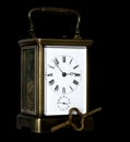 Vintage carriage clock on black background