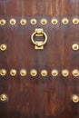 Antique bronze classic door knob on a wooden door