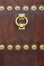 Antique bronze classic door knob on a wooden door
