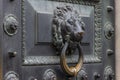 Antique bronze door knocking knob ring in the form of a lion`s face Royalty Free Stock Photo