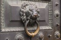 Antique bronze door knocking knob ring in the form of a lion`s face Royalty Free Stock Photo