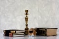 Antique bronze gilded book candlestick and porcelain figurine.