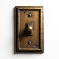 Antique bronze light switch on white background. Vintage toggle device with ornate frame for electrical control. Home decor Royalty Free Stock Photo