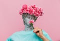 Antique bust of male with carnations bouquet in a hat