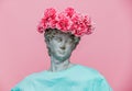 Antique bust of male with carnations bouquet in a hat