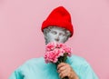 Antique bust of male in hat with carnations bouquet