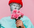 Antique bust of male in hat with carnations bouquet