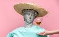 Antique bust of male in hat with martini glass