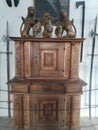 antique cabinet with lion decoration on top