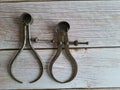 Antique calipers, on a wooden table, top view Royalty Free Stock Photo