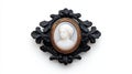 Antique cameo brooch on black ornate frame white isolated background Royalty Free Stock Photo
