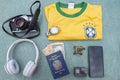 Antique camera, silver wristwatch, Brazilian soccer team t-shirt, headphones Royalty Free Stock Photo