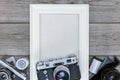 Antique cameras, negative films and white empty photo frame on w Royalty Free Stock Photo