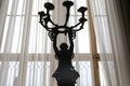 Antique Candlestick in front of window Royalty Free Stock Photo