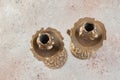 Antique candlesticks on concrete background