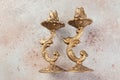 Antique candlesticks on concrete background