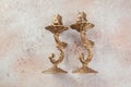 Antique candlesticks on concrete background