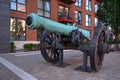 Antique cannon used as decoration at housing development adjacent to River Thames
