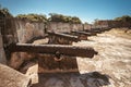 Antique cannons with traces of rust lined defend fortress in Dominican Republic