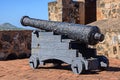 Antique cannons with traces of rust lined up to defend fort. Iron cannons