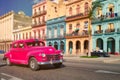 Antique car and colorful buildings in old Havana Royalty Free Stock Photo