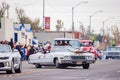 Antique car driving in Cowboy Christmas Parade