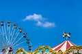 Antique carousel horses tent and colourful ferris wheel Royalty Free Stock Photo