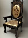 An antique carved wooden chair. The portrait of the emperor is embroidered on the back of the chair.