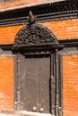 Antique carved wooden gate Courtyard of Kumari Bahal in Kathmandu Durbar Square