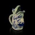 Antique ceramic jug in the shape of a frog.