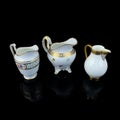 Set of antique milk jars with golden pattern. retro vessel for milk.