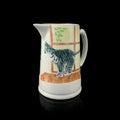 Antique milk jug with a picture of a cat.